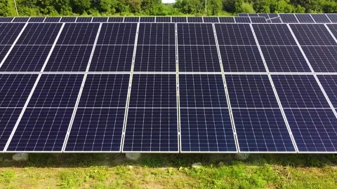 Solar panels farm on a hillside under a clear blue sky, clean energy concept. Vídeos de archivo 336237903