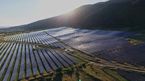 Solar panels in a field during sunset in a rural area Stock Footage 339167457