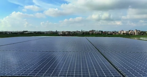 Solar panels floating in a lake seen from a drone perspective,View of the flo Stock Footage 257043335