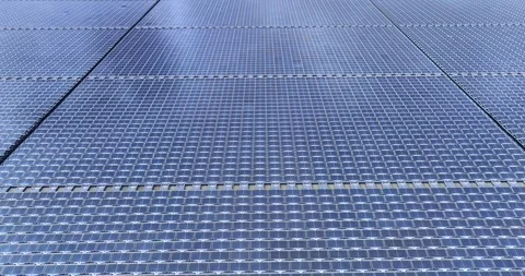Solar panels floating in a lake seen from a drone perspective,View of the flo Stock Footage 257043479