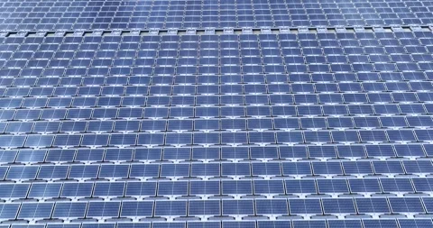 Solar panels floating in a lake seen from a drone perspective,View of the flo Stock Footage 257043481