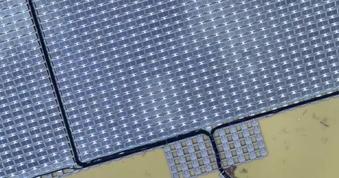 Solar panels floating in a lake seen from a drone perspective,View of the flo Stock Footage 257043671
