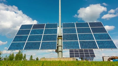Solar panels follow the sun, time-lapse Stock Footage