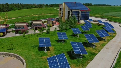Solar panels on grass. Modern building among nature  Stock Footage 132865137