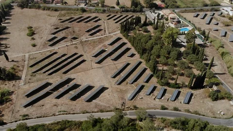 Solar Panels in Greece, examining through aerial (drone) Stock Footage 107344849