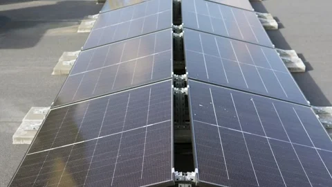 Solar panels on a high-rise rooftop, capturing clean energy in the city. Stock-Footage 319062005
