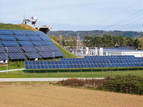 Solar panels on hillside reflect commitment to sustainable energy solutions Stock Photos