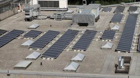Solar Panels on industrial building roof Stock Footage