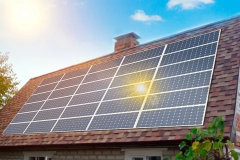 Solar panels installed and in use on roof of home. Reflecion sun Stock Photos