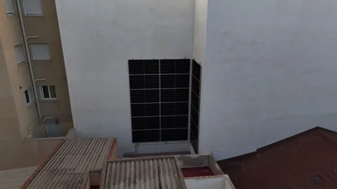 Solar Panels Installed On Building Wall In Urban Area Stock-Footage 340337083