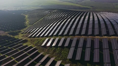 Solar panels installed on hills producing renewable energy for local use Stockbeeldmateriaal 329992874