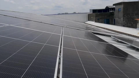 Solar panels installed on industrial warehouse roof generating renewable energy Video stock 334160830