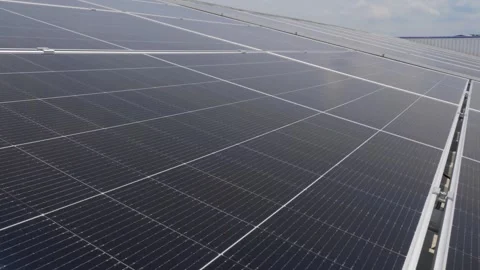 Solar panels installed on industrial warehouse roof generating renewable energy Video stock 334160835