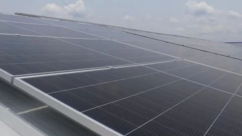 Solar panels installed on industrial warehouse roof generating renewable energy Video stock 334160836
