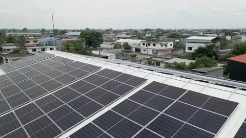 Solar panels installed on industrial warehouse roof generating renewable energy Video stock 334160871