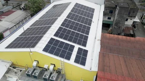 Solar panels installed on industrial warehouse roof generating renewable energy Video stock 334160930