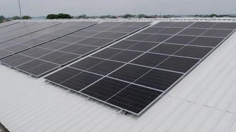 Solar panels installed on industrial warehouse roof generating renewable energy Video stock 334160980