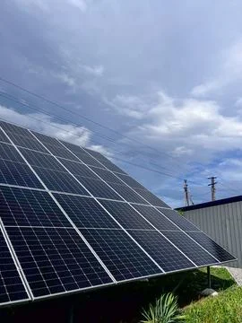 Solar Panels Installed at a Large Facility in an Open Area With Clear Skies.. Stock Photos