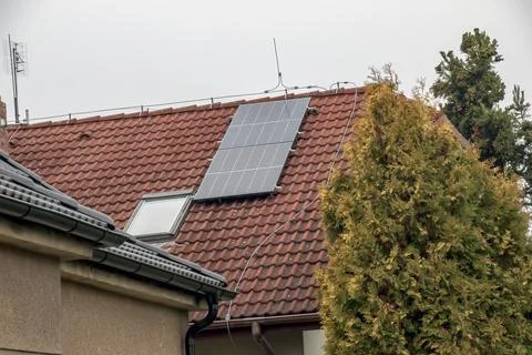 Solar Panels Installed on Red Tiled Residential Roof Stock Photos