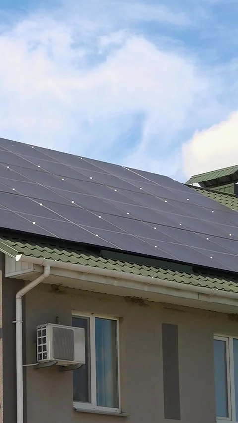 Solar panels installed on the roof of a city building - Vertical Video Stock Footage 342481053