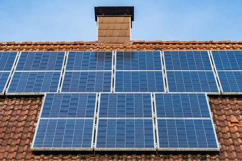 Solar panels installed on a rooftop elevating renewable energy use Stock Photos