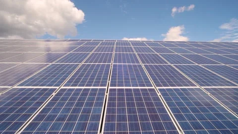 Solar panels installed in a rural area. Solar power plant in a field. Stock Footage 258120141