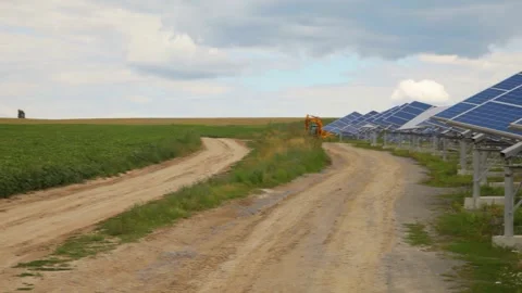 Solar panels installed in a rural area. Solar power plant in a field. Stock Footage 259692222