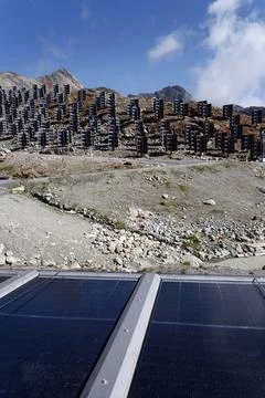 Solar panels lying on ground with vertically mounted four wings around cent.. Stock-Fotos