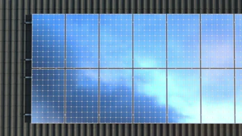 Solar panels modules on roof on a cloudy day - 4k Stock Footage 141086892