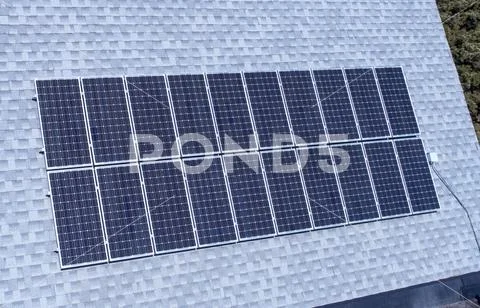Solar panels mounted on a roof Stock Photos