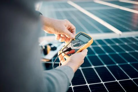 Solar panels, multimeter and engineering hands for voltage check, installation Stock Photos