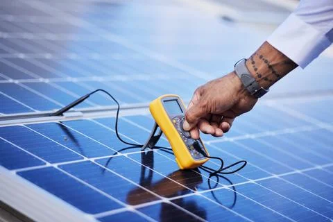 Solar panels, multimeter test and hands of technician check power, engineering Stock Photos
