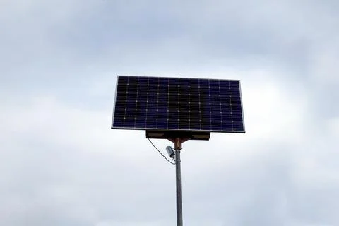 Solar panels on a pillar against the backdrop of a cloudy sky. Green energy Foto stock