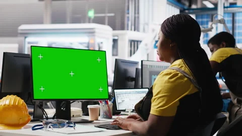 Solar panels plant engineer overseeing energy consumption using isolated screen Stock Footage 309070168