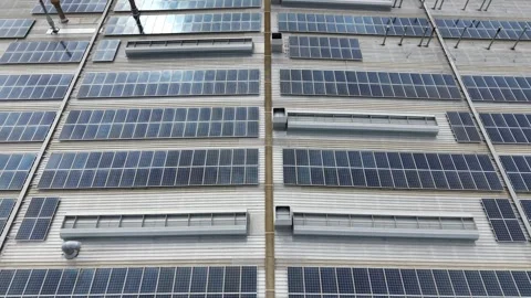 Solar panels producing renewable energy on an industrial roof 스톡 동영상 340503346