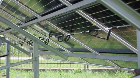 Solar panels in a progressive installation sequence, showcasing the intricate Stock Footage 318709474