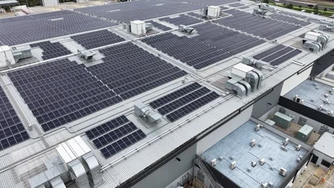 Solar panels providing renewable energy on industrial rooftop Stock-Footage 337810847