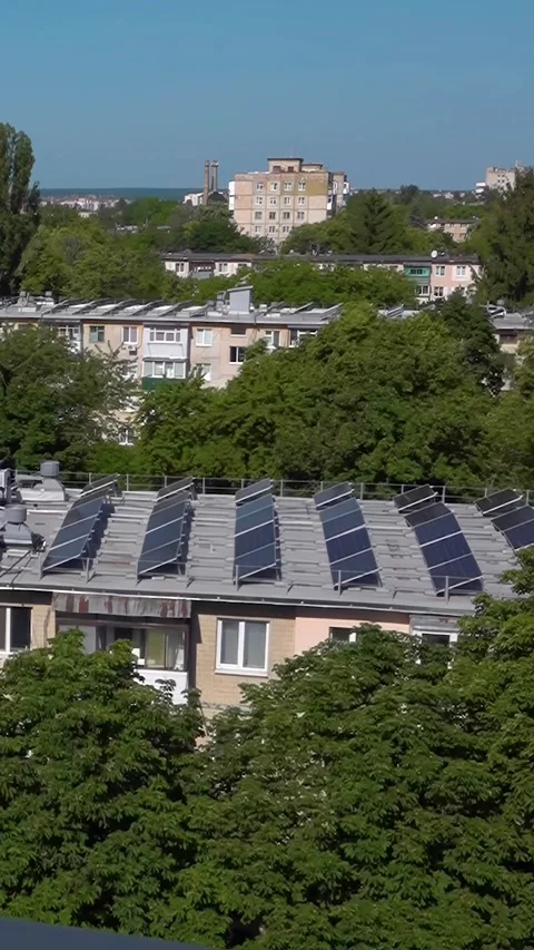 Solar panels on the roof of old Soviet apartment buildings. Vertical video Stock Footage 312200341