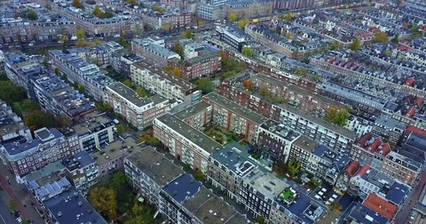 Solar panels on the roofs of long brick apartment rows 動画素材 71293158
