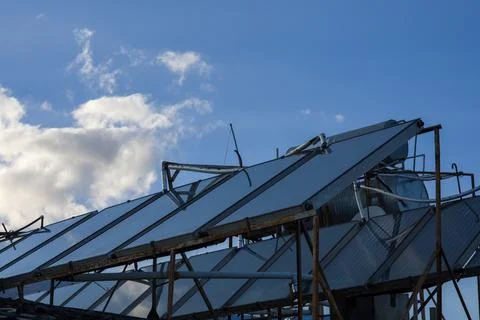 Solar panels on rooftop with blue sky Stock Photos