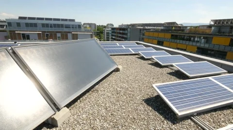 Solar panels on rooftop with city in background Stock Footage 68520062