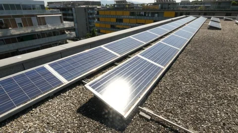 Solar panels on rooftop with city in background Stock Footage 68520067