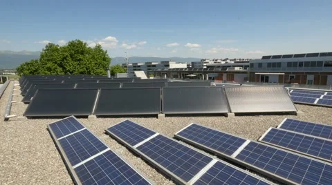 Solar panels on rooftop with city in background Stock Footage 68520088