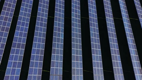 Solar panels on a rooftop gather sunlight during the day 動画素材 334028458