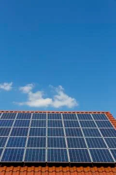 Solar panels on a rooftop, partial view Stock Photos