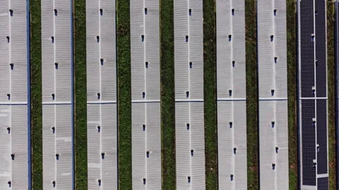 Solar panels on rooftops in a green area with pathways in between Stock-Footage 334029624