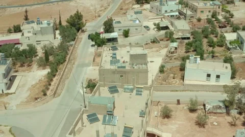 Solar panels on rooftops help empower distant rural villages in Jordan 5/5/2023 Stock Footage 297239975