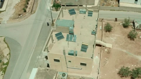 Solar panels on rooftops help energize Rural Middle Eastern Villages Stock-Footage 297239283
