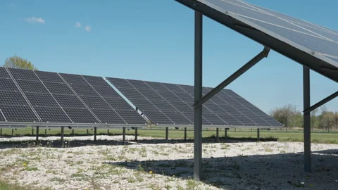 Solar panels rows installed on ground mounts at renewable energy farm Stock Footage 334318086