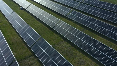Solar panels. Rows of solar panels on green grass. View from copter. Stock Footage 159913092